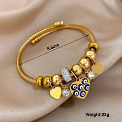 Gold Conch Shell Charm Bangle