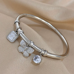 Gold Conch Shell Charm Bangle