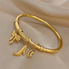 Gold Conch Shell Charm Bangle