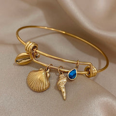 Gold Conch Shell Charm Bangle