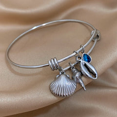 Gold Conch Shell Charm Bangle