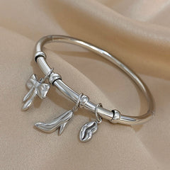 Gold Conch Shell Charm Bangle
