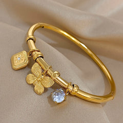 Gold Conch Shell Charm Bangle