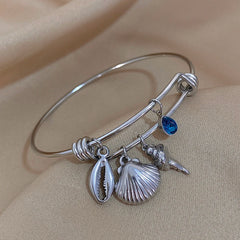 Gold Conch Shell Charm Bangle
