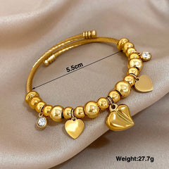 Gold Conch Shell Charm Bangle